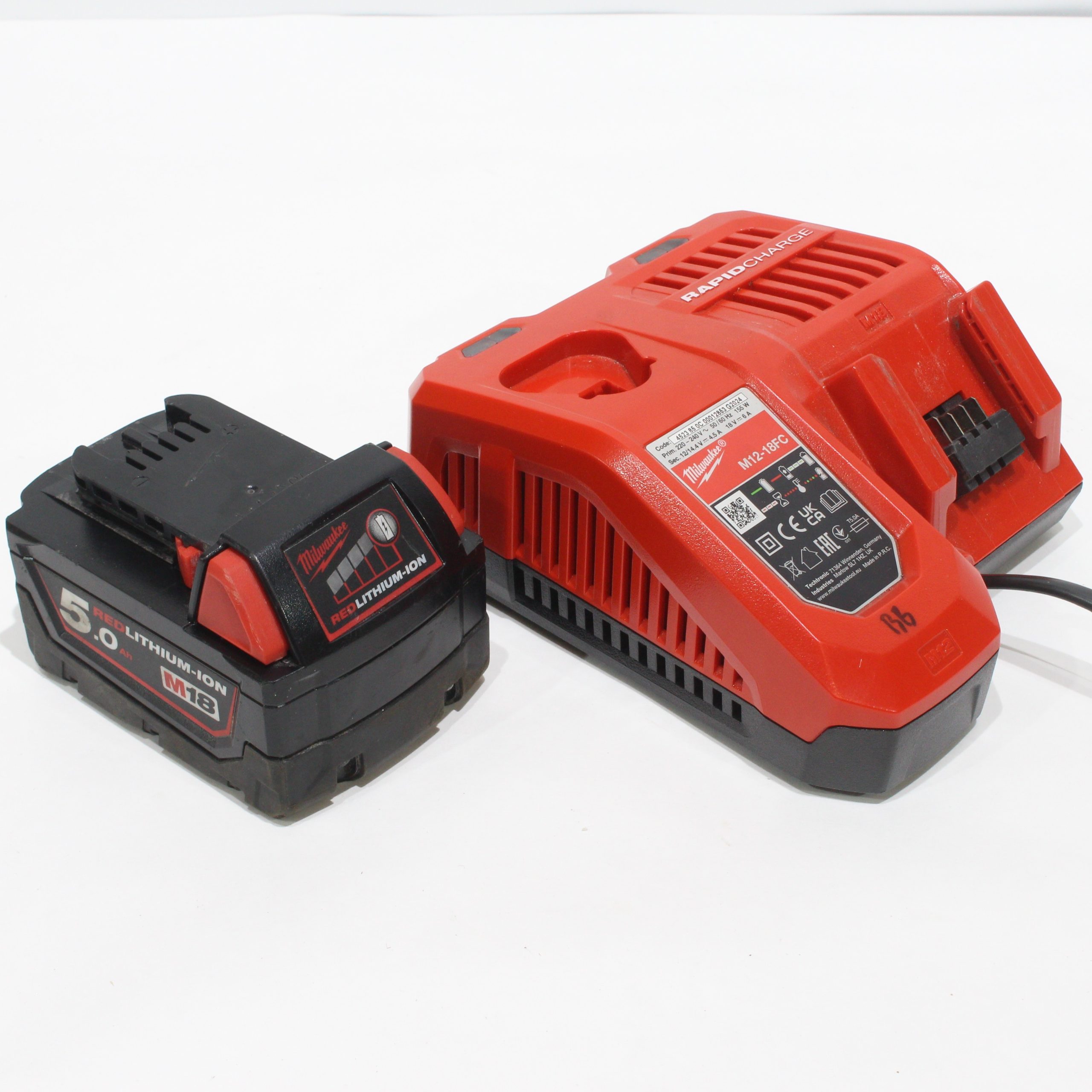 Milwaukee M18 B5 5,0 Ah batteri + M12-18 FC hurtiglader Milwaukee M18 B5 5,0 Ah batteri + M12-18 FC hurtiglader - Bilde 1